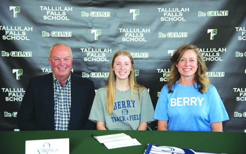 Photo courtesy Austin Poffenberger. Seated with her parents, Macy Murdock of Tallulah Falls signs her letter of intent on Jan. 13 to compete in track and field with Berry College.