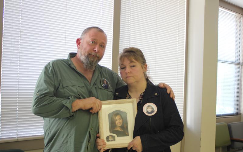 Megan Broome/The Clayton Tribune. Parents of Courtney Faith Zajdowicz, David Cross and Crystal Zajdowicz Cross, wear buttons and display a picture of Zajdowicz at the Rabun County Courthouse Tuesday, following the decision by Superior Court Judge B. Chan Caudell to grant the State’s motion to revoke bond for Jaime Avila Reyes in regard to the crash that killed Zajdowicz. Cross stated that the family is happy with Judge Caudell’s decision.