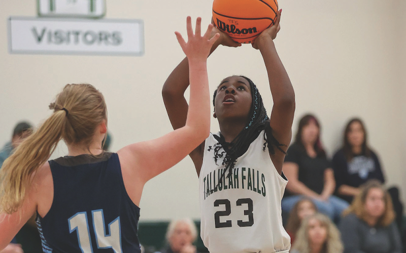 Photo courtesy of Austin Poffenberger. TFS’s Narissa Dawson elevates her shot for the Lady Indians.