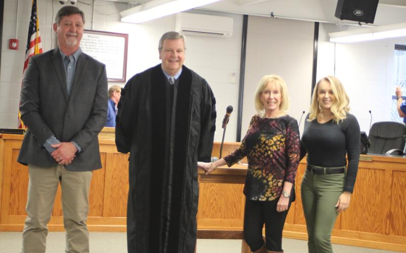 Megan Broome/The Clayton Tribune. Clayton candidates for mayor and council member positions elected Nov. 2 were sworn-in to office Monday by Probate Judge Carlton H. Jones III. Mayor Kurt Cannon, left, Probate Judge Carlton H. Jones III, Council Member Althea Bleckley and Council Member Amanda Harrold pose for photographs following the ceremony.