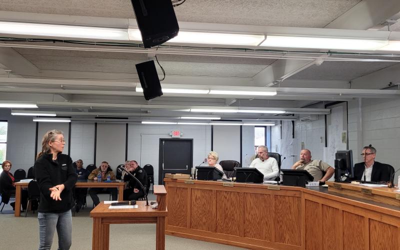 Megan Broome/The Clayton Tribune. Nicole Hayler, executive director of Chattooga Conservancy, addressed council members about a blocked culvert that channels Stekoa Creek under Chechero Street.