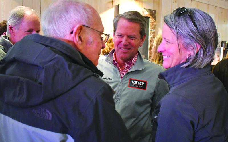 Enoch Autry/The Clayton Tribune. Gov. Brian Kemp (center) talks with Rabun County residents Alton Story, left, and Caroline Wallis, executive director of FAITH,during a scheduled meet-and-greet stop at the Clayton Cafe on Main Street.