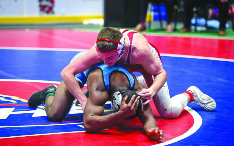 Submitted photo. Wildcat junior Miles Watts gets the advantage on his opponent Chris Mance of Lovett in the 152-pound Class AA wrestling championship match. Watts would ultimately fall to Mance in a 5-4 decision to become the state runner-up.