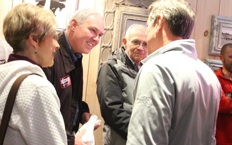 Megan Broome/The Clayton Tribune. Cassandra Clouser, Clayton DDA chair, Rick Story, director of development for Rabun County, and Alton Story talk with Gov. Brian Kemp during a meet-and-greet in Clayton Feb. 18.