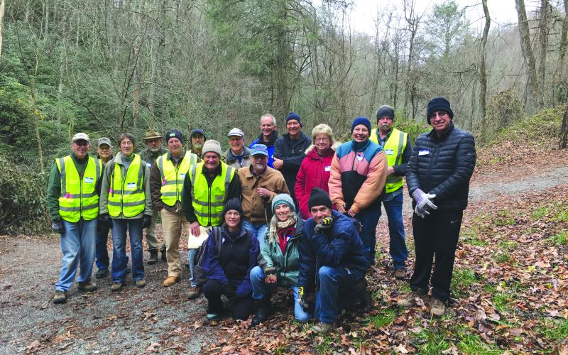 Submitted photo. Sky Valley hemlock treatment crew: Save Georgia’s Hemlocks (SGH) facilitators are in yellow vests. Standing, left to right: Jon Jones, Larry Randolph, Marie Dunkle, Tom Zimmerlink, Pat Hickey, Al Battle, SGH chair and project leader Buz Stone, Jim Curtis, Carl Lynn, Reggie Davis, Howard Beckert, SGH director Donna Shearer, Lena Petersen, Jody Webb and Bruce Gant. Kneeling, left to right: Debbie Davis, Lou MacNaughton and Jon Tiamno.