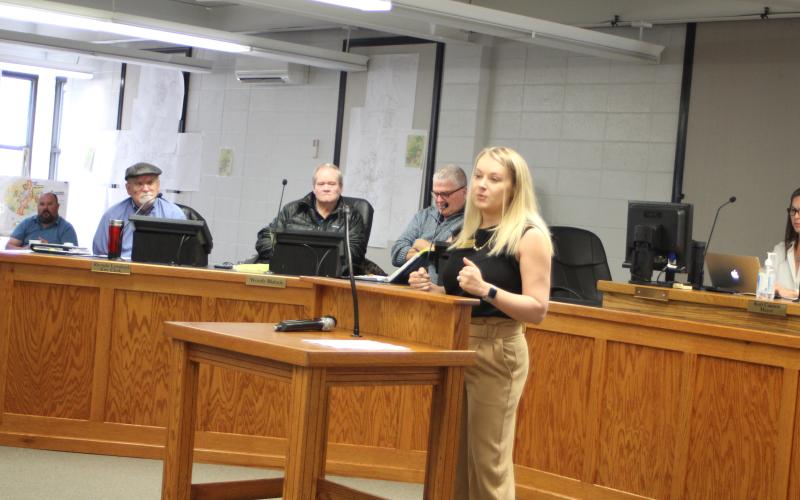 Megan Broome/The Clayton Tribune. Clayton City Council Member Amanda Harrold speaks to a crowded room of citizens at Monday’s hearing in the City of Clayton courtroom for a rezoning hearing for property located across from Clayton City Hall, 37 Bynum St./0 Holden st.  The hearing was to rezone the property from Residential Zone (R2) and Highway Business (HB) to Planned Unit Development (P.U.D.).