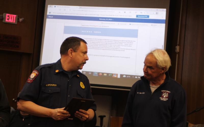 Megan Broome/The Clayton Tribune. Rabun County Fire Services Assistant Chief Justin Upchurch recognizes Firefighter Gordon Van Mol in an emotional presentation at the Rabun County Board of Commissioners meeting Feb. 22, and honors the first responders whose heroic actions saved Van Mol’s life after he went into cardiac arrest while battling a brush fire Nov. 27.