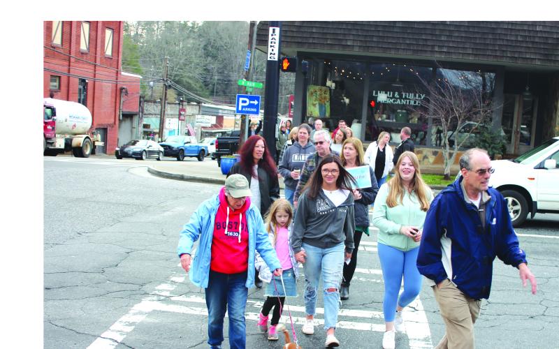 Megan Broome/The Clayton Tribune. Community members participate in a Mental Health March hosted by Georgia Mountain Psychological Associates Feb. 22. The march and candlelight service were held to remember those who have lost their lives to mental illness.
