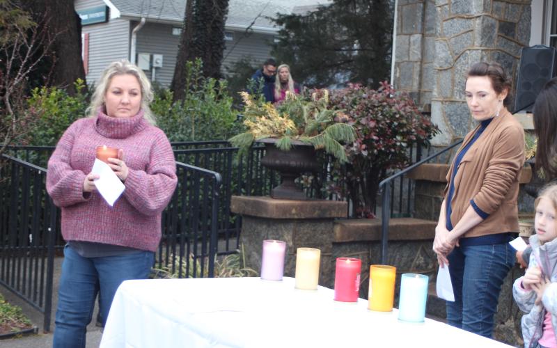 Megan Broome/The Clayton Tribune. Jessica Robinson lights a candle in honor of those who have suffered from and lost their lives to mental illness. A candlelight service and Mental Health March hosted by Georgia Mountain Psychological Associates were held Feb. 22 to remember those who have lost their lives to mental illness.