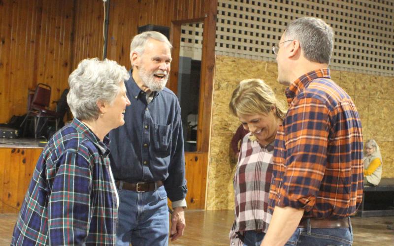 Megan Broome/The Clayton Tribune. Anne Pledger, left, Bob Pledger, Laura DeFilippo, and Charlie Pledger dance while enjoying the music and each other's company at the soft opening of the Mountain City Playhouse last Saturday.