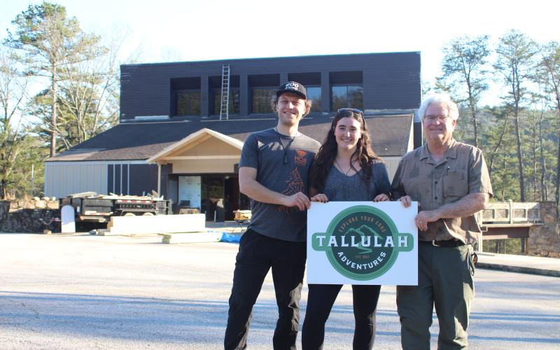 Megan Broome/The Clayton Tribune. Tallulah Adventures, LLC is coming to Tallulah Falls this summer. A soft opening will be held in the summer of 2022 and a grand opening is planned for the fall. Kyle Jerome, food service manager, left, Spencer Turk, with business development, and Bill Turk, managing member, stand in front of the old Georgia Power building that is being repurposed for the business a couple weeks ago. Crew members have continued the process of repurposing the facility.