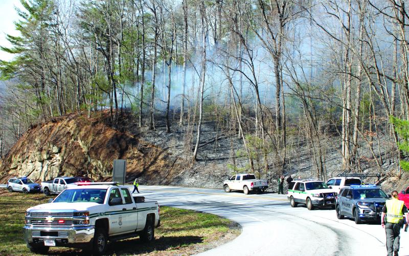 Megan Broome/The Clayton Tribune. The cause of a Highway 246 fire in Sky Valley remains unknown. A separate brush fire started across the state line in North Carolina.