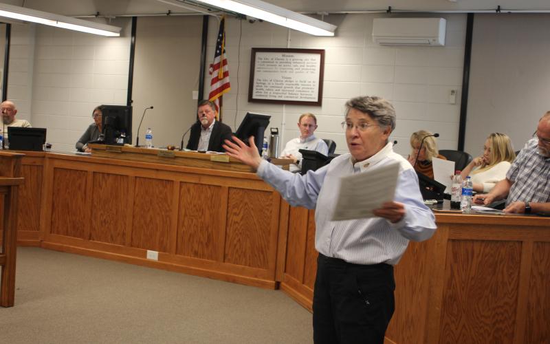Megan Broome/The Clayton Tribune. Clayton resident Dee Daley expresses her thoughts and concerns on rezoning of property across from Clayton City Hall to P.U.D. and site plans for the 91-unit development, at the Clayton City Council meeting Tuesday. Daley lives in the condos adjacent to the property requested for rezoning. Daley is also involved with the Rabun County Coalition for Good Government and outlined suggestions the organization has for development of the property.