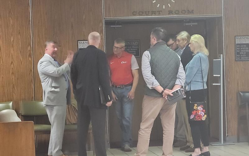 Rabun County Attorney Allyn Stockton talks with a group of people after a trial in Superior Court March 31, following the court's decision to overrule an approval by the Rabun County Board of Commissioners May 25, 2021 to rezone property on Bridge Creek Rd. from Agricultural (A) to Commercial Business (CB). Pictured are Stockton with Matt Mitcham; Darrin Giles, Rabun County administrator; Brian Parker; Elizabeth Gill; Chip Groom, president of LBCA; and Shylan Wood, County planning and zoning administrator.