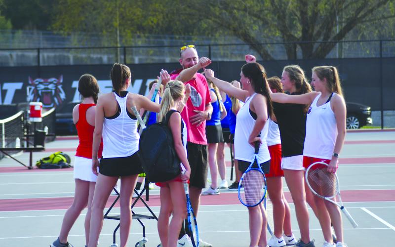 Enoch Autry/The Clayton Tribune. Rabun County head tennis coach Bryan Getty rallies the Ladycats as they prepare to take on Banks County in the Region 8-AA championship match at home Tuesday. RCHS would win the contest 3-2.