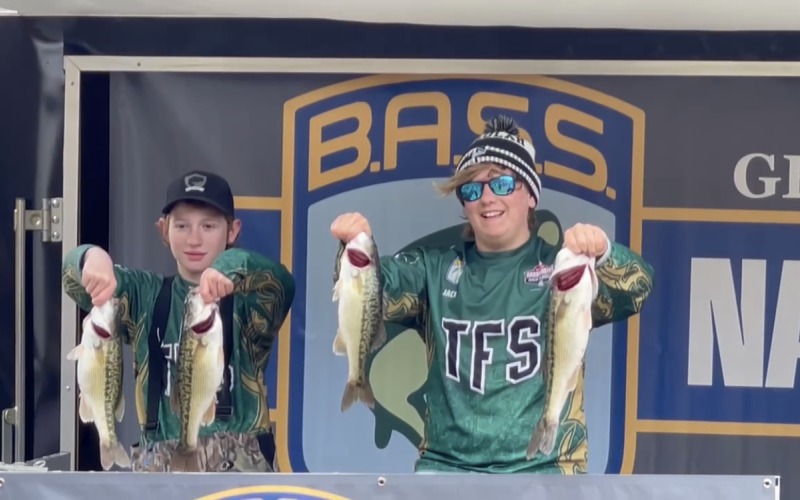 TFS Athletics. Middle schoolers DJ Broome and Jack Thomson hold the bass that helped them finish in 16th place at the Lake Lanier tournament.