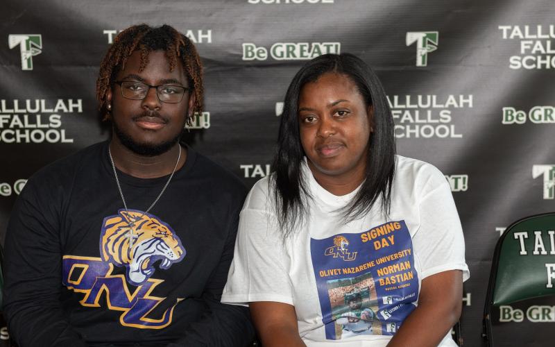 Photo by Lane Gresham. Norman Bastian who signed a national letter of intent to play baseball at Olivet Nazarene University poses for a photograph with his mother Alexandria Gabriel on the Tallulah Falls campus on March 23.