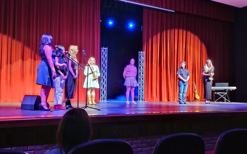 Photo courtesy of Conner Horn. Contestants in the Rabun Idol competition stand on stage after awards were presented at the Rabun County High School Fine Arts Building March 19. Hailey Smith took home the award for Judges’ Choice and Ashlynn Blackwell took home the award for Fan Favorite. Nathaniel Burrell, Kyleigh Sliker, and Emma Rose Hunter also competed in the event. Emceed for the night was Jocelyn Gaspar, Beverly Diaz and Kiley Turner. Judges were Allen Blair, Alicia Kilby and Daven Vandenberg.
