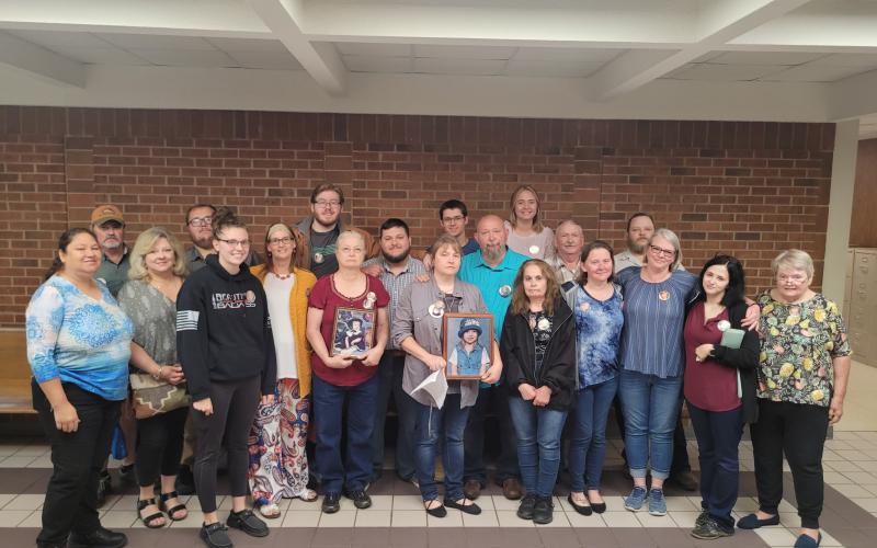 Megan Broome/The Clayton Tribune. Dozens of family members and friends of Rabun County Detention Center Officer Courtney Faith Zajdowicz donned memory buttons of Zajdowicz during Wednesday's court hearing.