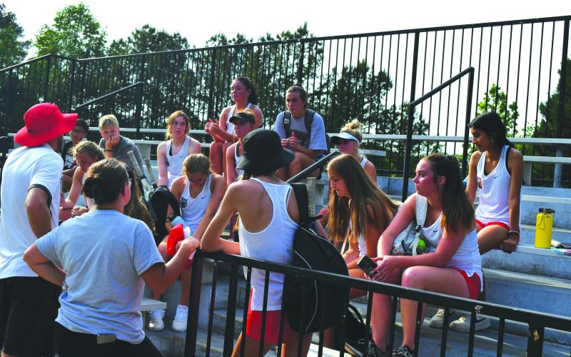 Enoch Autry/The Clayton Tribune. The Rabun County coaches Bryann Getty and Jenn Ramey talk with their Ladycat tennis players after their May 5 loss at Pace Academy  in the Class AA state Final Four. The RCHS season was the best ever for the program as the girls reached the semifinals for the first time ever.