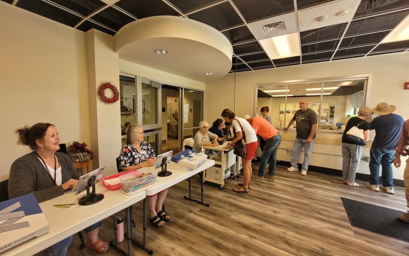 Megan Broome/The Clayton Tribune. A group of voters cast their ballots during advanced voting on Tuesday at the Rabun County Board of Elections Office on South Main Street in Clayton. Early voting continues to May 20 for the May 24 election.