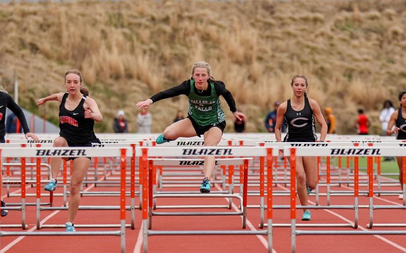 Photo by Austin Poffenberger. Macy Murdock clears the 100-meter hurdles for the Lady Indians.