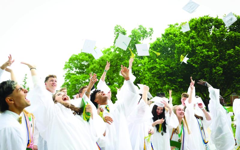 Photo courtesy RGNS. The Rabun Gap-Nacoochee School Class of 2022 tosses hats to celebrate the end of graduation on Sunday, May 15. The Class of 2022 is the largest graduating class in school history with 102 students.
