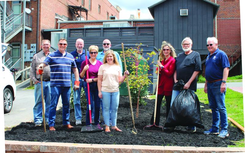 Megan Broome/The Clayton Tribune. Clayton Downtown Development Authority (DDA) members and Rotarians from the Rotary Club of Clayton plant flowers and a tree at the Charlie Mac Dickerson Memorial Park recently. Pictured are Keith Jackson; Tony Penrose; Matt Mitcham; Cassandra Clouser; DDA chair; Leif Ericson; Sonya Shook; Karen Bacon; Jim Antosiak; and Jef Fincher, Rotary Club of Clayton president.