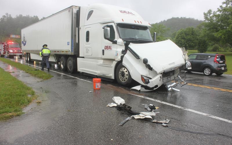 Megan Broome/The Clayton Tribune. A Georgia State Patrol trooper investigates the May 23 crash of a tractor trailer. A total of three tractor trailers were involved in the crash.