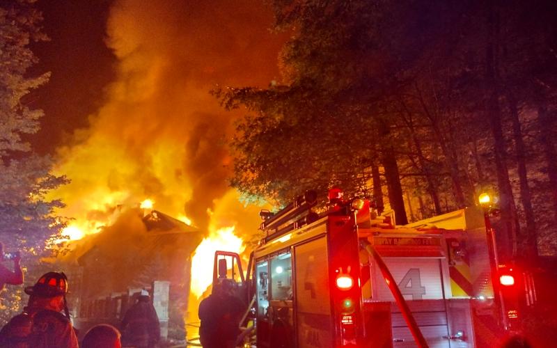 Photo courtesy of Conner Horn. Rabun County Fire Services continue to fight a three-story house fire on Lake Rabun Monday night. Crews remained on the scene into the morning hours. The fire could be seen for miles. The vacation house was deemed a complete loss.