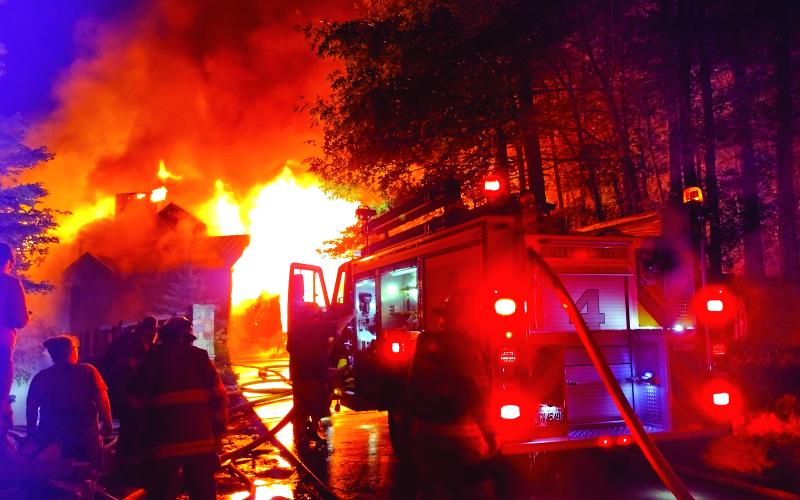 Photo courtesy of Conner Horn. Rabun County Fire Services continue to fight a three-story house fire on Lake Rabun Monday night. Crews remained on the scene into the morning hours. The fire could be seen for miles. The vacation house was deemed a complete loss.