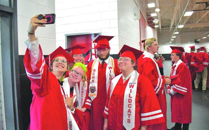 Enoch Autry/The Clayton Tribune. Tobias Ramey takes a selfie with her fellow Rabun County graduates before the May 27 ceremony.