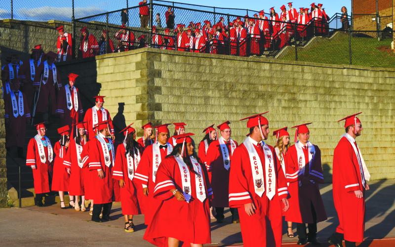 Enoch Autry/The Clayton Tribune. The RCHS Class of 2022 enters the stadium for graduation.