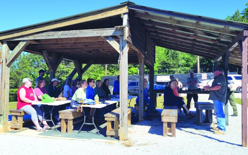 Megan Broome/The Clayton Tribune. Lt. Mark Gerrells instructs the Ladies’ Firearm Safety Course held at the Rabun County Sheriff’s Office training facility in Tiger May 28.
