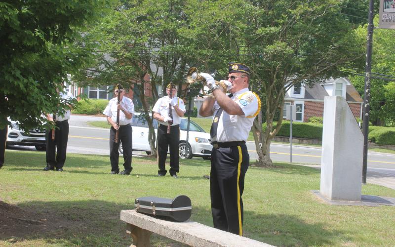 Megan Broome/The Clayton Tribune. Chaplain Dr. Kenneth Franklin plays “Taps” at the Memorial Day ceremony held at the Rabun County Courthouse Monday.