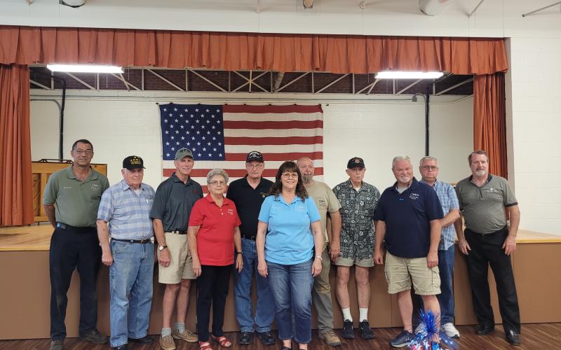 Megan Broome/The Clayton Tribune. Pictured are Council Member Michael Holt, left; veteran Doug Wayne; veteran Jon Jones; Mayor Grace Watts; veteran Gary Cantwell; Council Member Brenda Hooper; veteran David Cross; veteran David Ruth; Council Member Robert Sutton; veteran Bill Fountain and veteran Chris DiNofrio. Not pictured is Council Member Eric McCrackin.