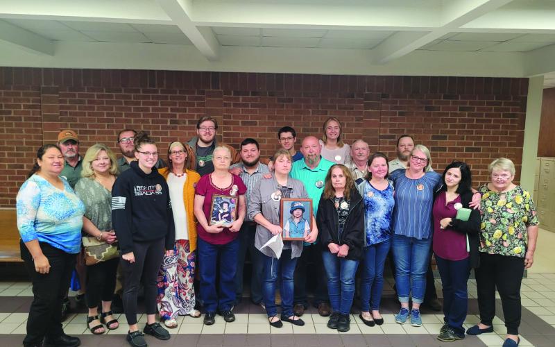 Megan Broome/The ClaytonTribune. Dozens of family members and friends of Rabun County Detention Center Officer Courtney Faith Zajdowicz donned memory buttons of Zajdowicz during the May 25 court hearing. Jaime Avila Reyes was sentenced to 15 years to serve.