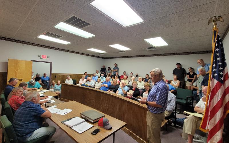 Megan Broome/The Clayton Tribune. Chip Groom, president of Lake Burton Civic Association (LBCA), speaks to the Rabun County Planning Commission in opposition of the proposed rezoning on Bridge Creek Road for the purpose of building storage units.
