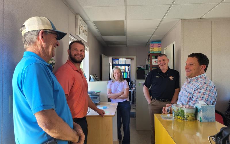 Megan Broome/The Clayton Tribune. Tyler Harper, Georgia State Senator for District 7 and Republican nominee for state agriculture commissioner, speaks with  Ricky, Clint and Melinda James of Osage, as well as Rabun County Sheriff Chad Nichols and Georgia State Sen. Bo Hatchett of District 50.