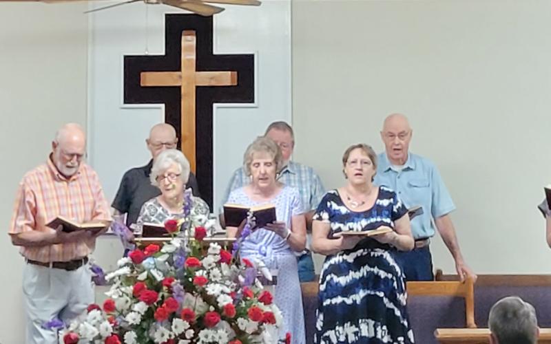 Megan Broome/The Clayton Tribune. Choir members at Bethel Baptist Church sing their hearts out to praise and worship Jesus for the 130th Anniversary celebration for the church in Tiger July 17.
