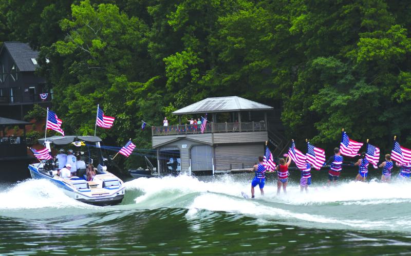 Enoch Autry/The Clayton Tribune. The skiers are pulled by the boat across the waters on Lake Burton.
