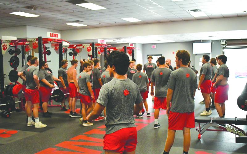 Enoch Autry/The Clayton Tribune. RCHS football players gather for their weightlifting assignments on July 14.