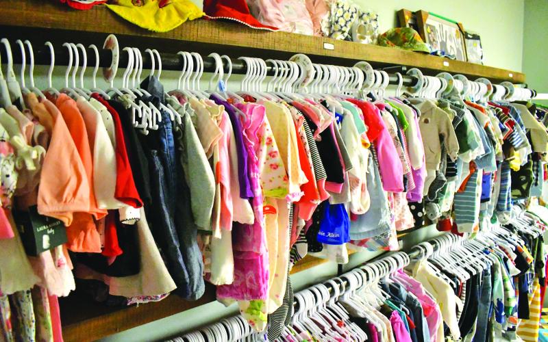 Enoch Autry/The Clayton Tribune. Some of the clothes available for infants and toddlers with "Baby Bucks."