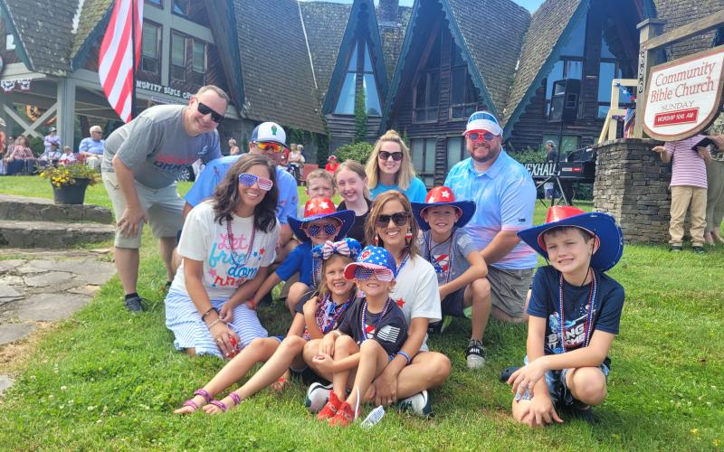 Megan Broome/The Clayton Tribune. Bob Kopseky; Justin Judy; William Kopesky; Jessie Kopesky; Lori Kopesky; Jonathan Judy; Jamie Judy; John Judy; Hayden Judy; Ethan Judy; Ashley Judy; Gavin Judy; and James Judy enjoy watching the Sky Valley Grand Parade on July 2 while dressed in patriotic attire.