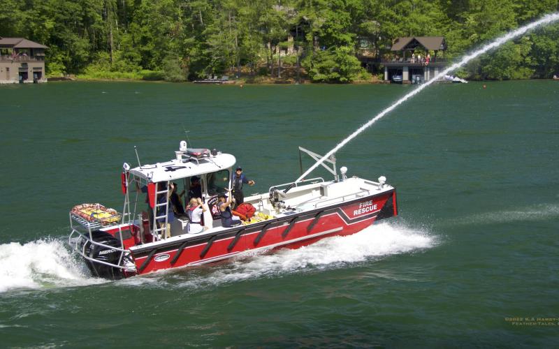 Photo courtesy of KA Hamdy-Swink. The Station 4 Lakemont-Wiley fire boat is part of the Lake Rabun Wooden Boat parade as tradition.