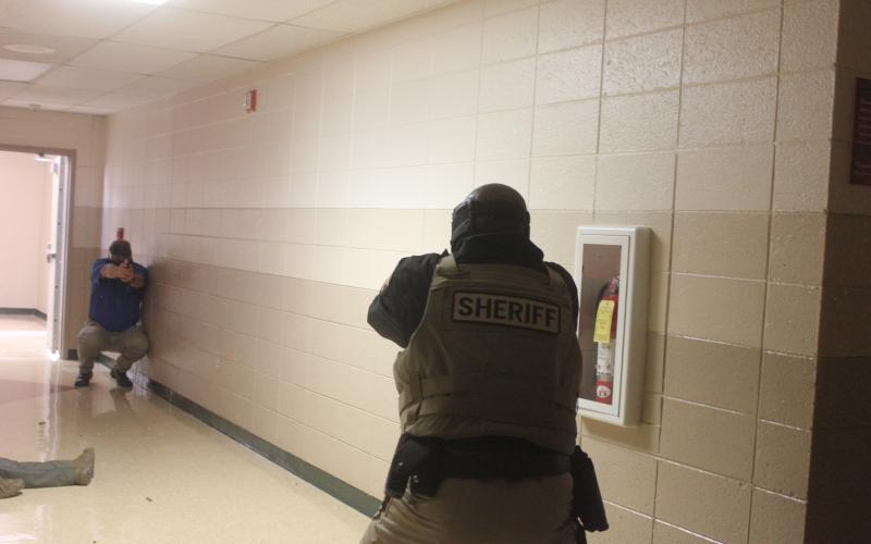 Megan Broome/The Clayton Tribune. Deputies participate in active shooter response training at Rabun County Schools last week to prepare for the return of students to school August 5.