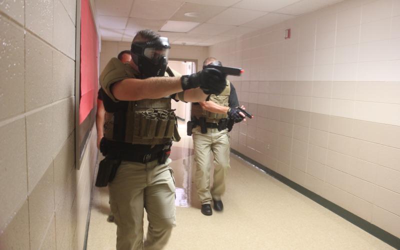 Megan Broome/The Clayton Tribune. Deputies participate in active shooter response training at Rabun County Schools last week to prepare for the return of students to school August 5.