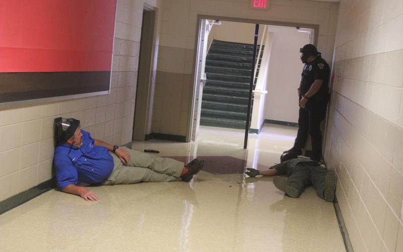 Megan Broome/The Clayton Tribune. Deputies participate in active shooter response training at Rabun County Schools last week to prepare for the return of students to school August 5.