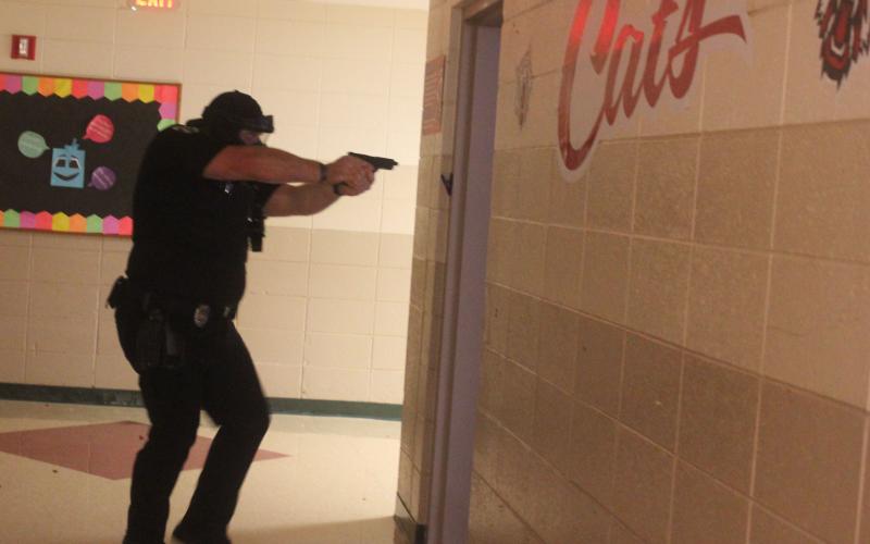 Megan Broome/The Clayton Tribune. Deputies participate in active shooter response training at Rabun County Schools last week to prepare for the return of students to school August 5.