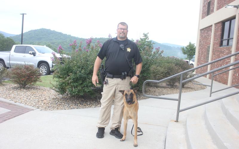 Megan Broome/The Clayton Tribune. Rabun County Middle School Resource Deputy Eric McKinney and K-9 Bo are ready to greet students on the first day of school Aug. 5.